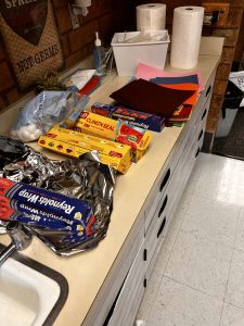 Supplies for the project such as foil, cotton balls, felt, foam, paper towels and straws. 